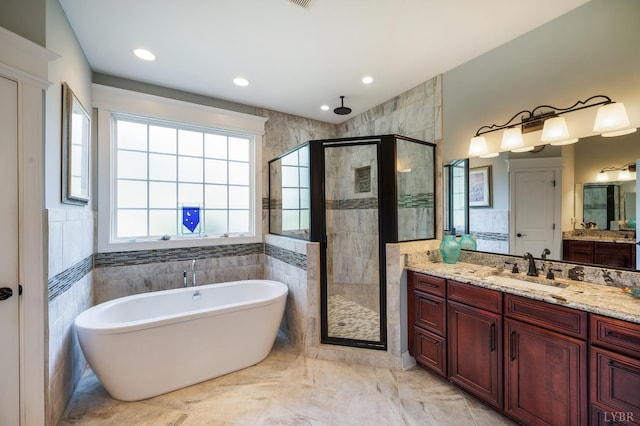 1424 Lake Manor Dr, Forest, VA 24551 - full bathroom featuring a stall shower, a freestanding bath, vanity, recessed lighting, and marble finish flooring