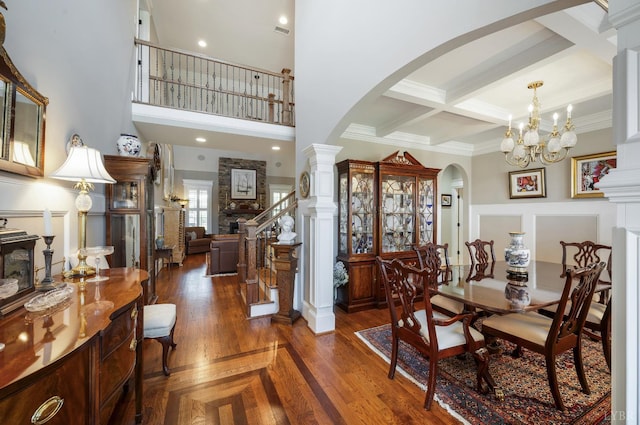 1424 Lake Manor Dr, Forest, VA 24551 - dining space featuring arched walkways, beamed ceiling, a chandelier, stairs, and ornamental molding
