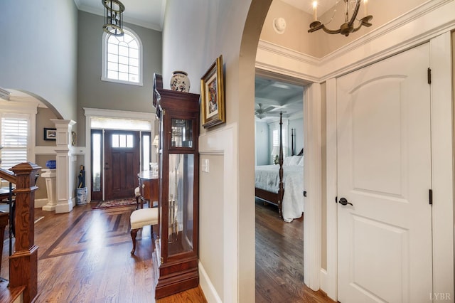 1424 Lake Manor Dr, Forest, VA 24551 - foyer featuring arched walkways, crown molding, wood finished floors, and a chandelier