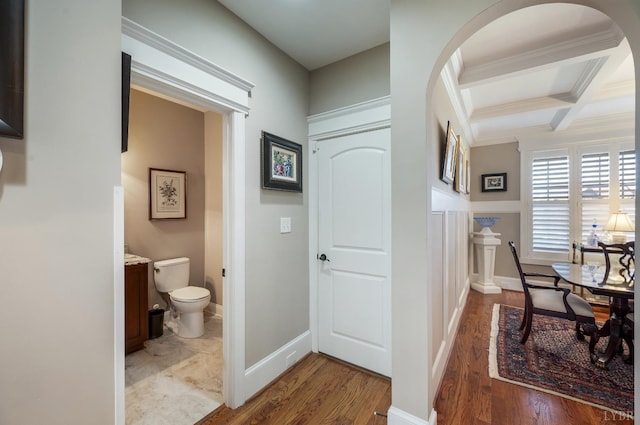 1424 Lake Manor Dr, Forest, VA 24551 - hall featuring coffered ceiling, wood finished floors, beam ceiling, arched walkways, and crown molding