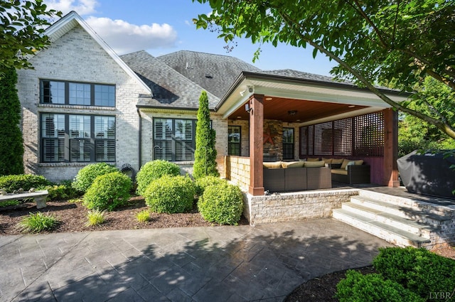1424 Lake Manor Dr, Forest, VA 24551 - view of front facade featuring an outdoor living space, a patio area, and a shingled roof