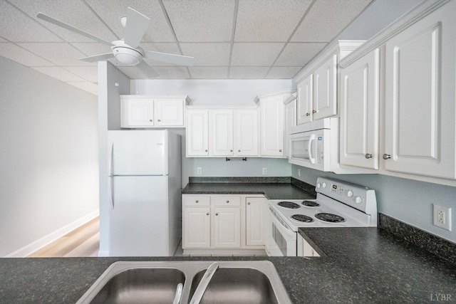 1313 Enterprise, Lynchburg, VA 24502 - kitchen with white appliances, a paneled ceiling, dark countertops, white cabinets, and a ceiling fan