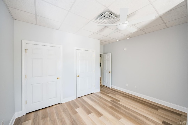1313 Enterprise, Lynchburg, VA 24502 - unfurnished bedroom featuring a drop ceiling and light wood-style flooring