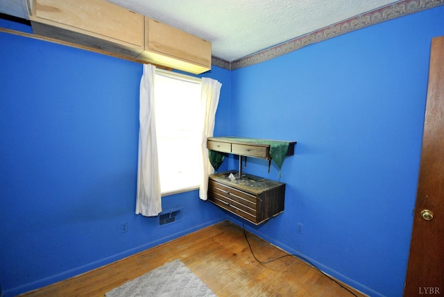 315 Cork St, Lynchburg, VA 24503 - unfurnished bedroom featuring wood finished floors and a textured ceiling
