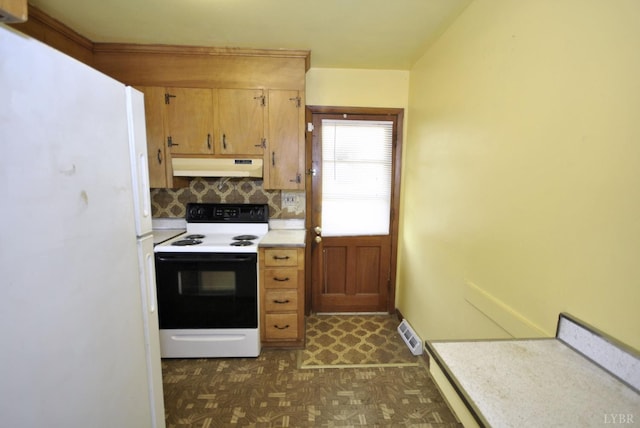 315 Cork St, Lynchburg, VA 24503 - kitchen with freestanding refrigerator, electric range, under cabinet range hood, dark flooring, and light countertops