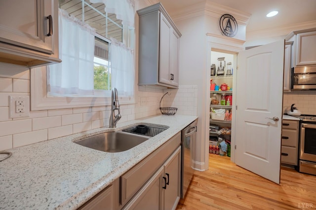 1507 Helmsdale Dr, Forest, VA 24551 - kitchen featuring stainless steel appliances, decorative backsplash, light wood finished floors, and light stone countertops