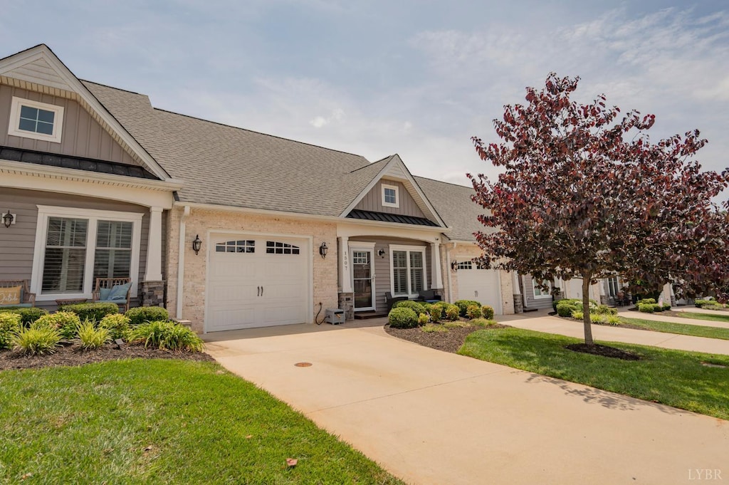 1507 Helmsdale Dr, Forest, VA 24551 - craftsman-style home with board and batten siding, a garage, driveway, and a shingled roof