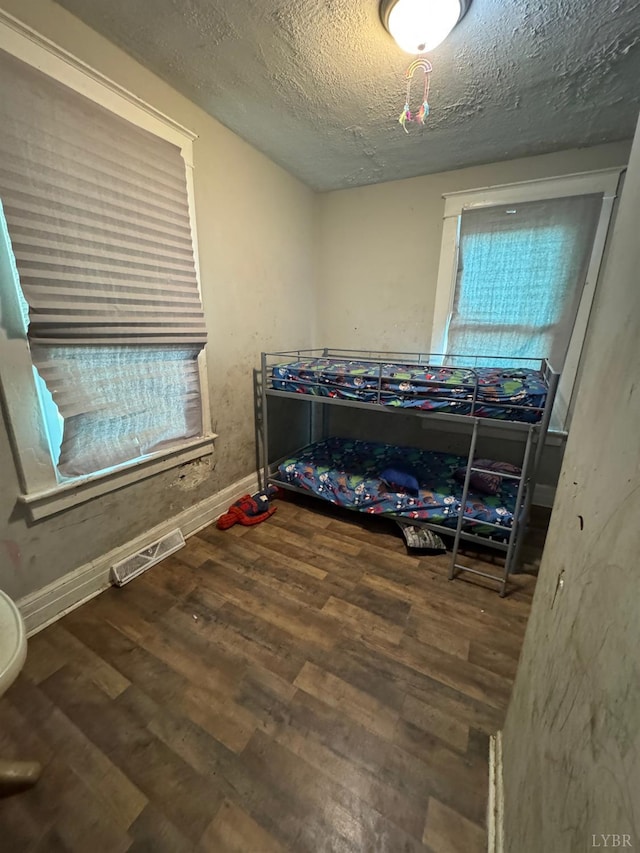 2402 Fairview Ave, Lynchburg, VA 24501 - bedroom with wood finished floors and a textured ceiling