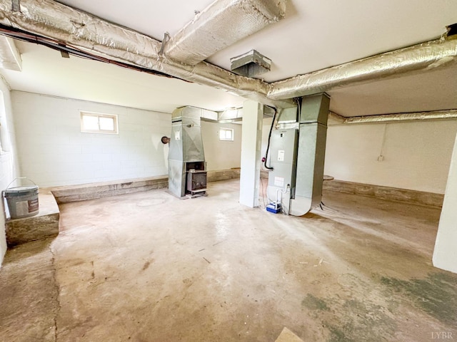 1033 8th St, Altavista, VA 24517 - basement featuring heating unit, healthy amount of natural light, and concrete block wall