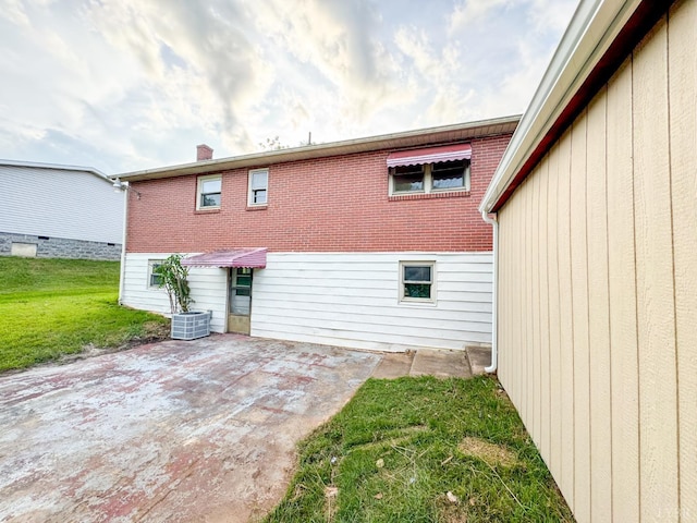 1033 8th St, Altavista, VA 24517 - back of house featuring a patio area, a lawn, and a chimney