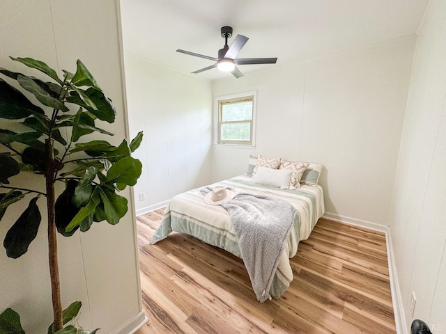 1033 8th St, Altavista, VA 24517 - bedroom featuring light wood finished floors, ceiling fan, and a decorative wall