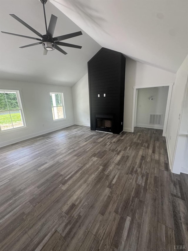 601 Mockingbird Ln, Gladstone, VA 24553 - unfurnished living room featuring vaulted ceiling, dark wood-style floors, a large fireplace, healthy amount of natural light, and a ceiling fan