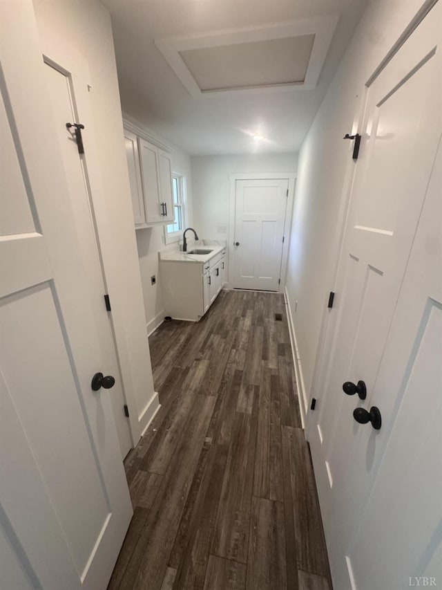 601 Mockingbird Ln, Gladstone, VA 24553 - laundry room featuring cabinet space, dark wood-style floors, and attic access