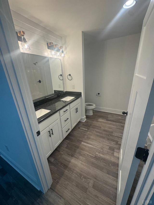 601 Mockingbird Ln, Gladstone, VA 24553 - bathroom featuring double vanity and wood finished floors