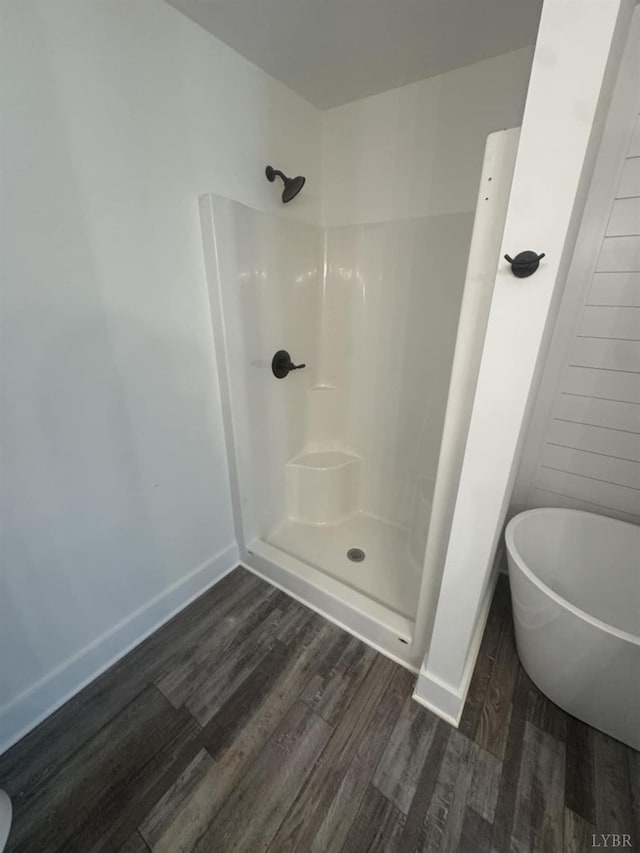 601 Mockingbird Ln, Gladstone, VA 24553 - full bath with wood finished floors, a soaking tub, and a shower