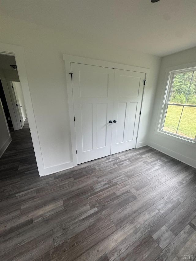 601 Mockingbird Ln, Gladstone, VA 24553 - unfurnished bedroom featuring dark wood-style flooring and a closet