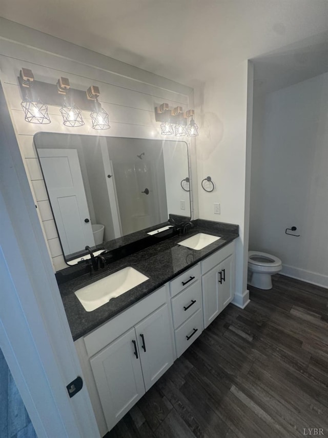 601 Mockingbird Ln, Gladstone, VA 24553 - full bathroom featuring double vanity, wood finished floors, and a stall shower