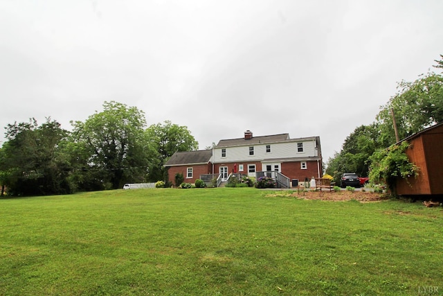 1538 Redfields Rd, Appomattox, VA 24522 - rear view of house featuring a yard and a chimney