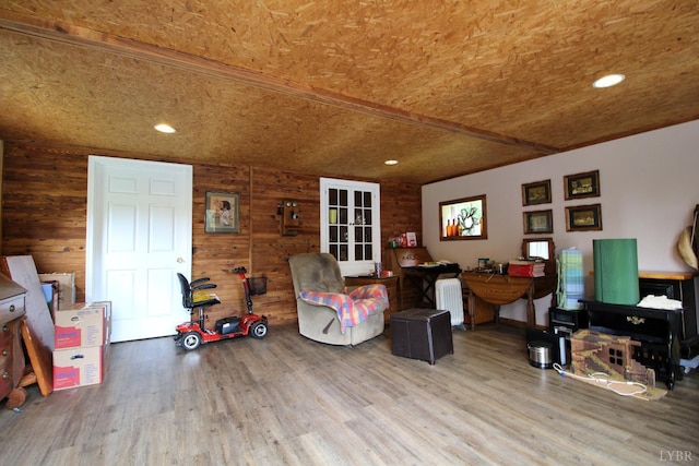 1538 Redfields Rd, Appomattox, VA 24522 - living area featuring wood finished floors, wooden walls, recessed lighting, french doors, and radiator