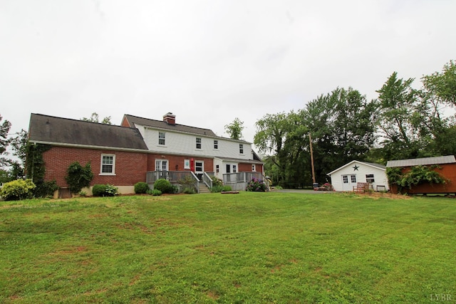 1538 Redfields Rd, Appomattox, VA 24522 - rear view of property featuring brick siding, a lawn, a deck, and a chimney
