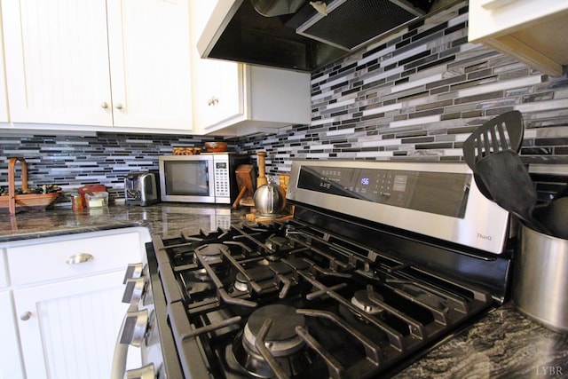 1538 Redfields Rd, Appomattox, VA 24522 - kitchen view of appliances with stainless steel finishes, white cabinetry, backsplash, and ventilation hood