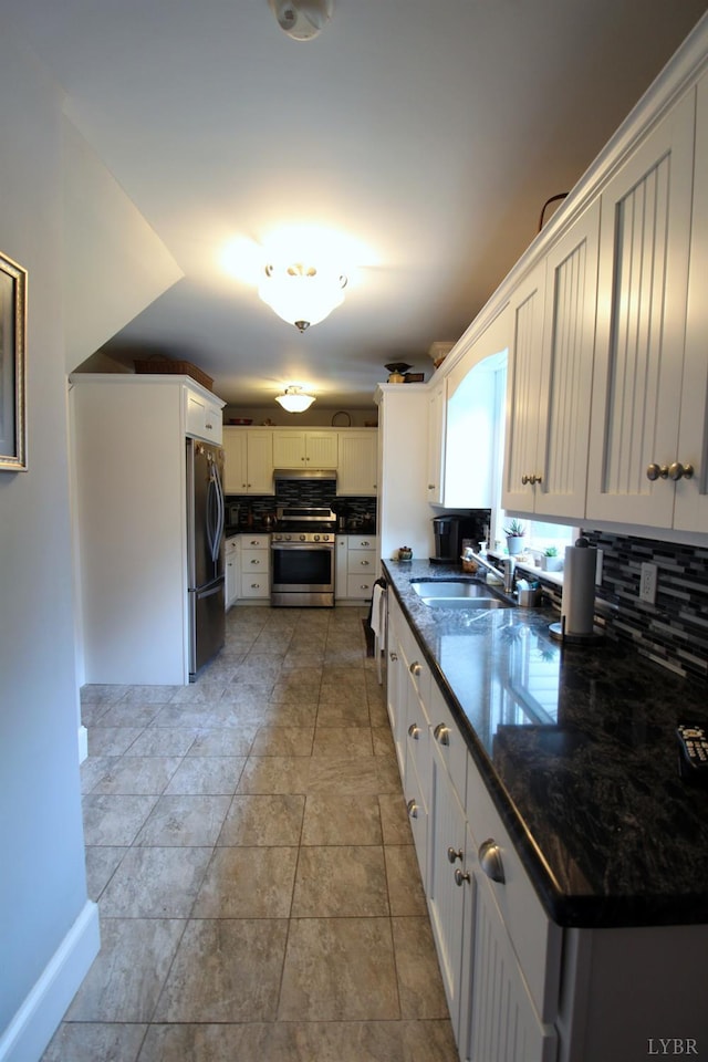 1538 Redfields Rd, Appomattox, VA 24522 - kitchen featuring stainless steel appliances, tasteful backsplash, white cabinets, and dark stone countertops