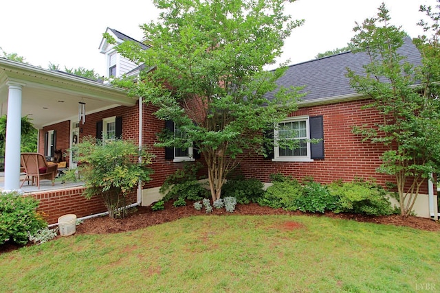 1538 Redfields Rd, Appomattox, VA 24522 - view of front of home featuring a front yard, brick siding, a porch, and roof with shingles