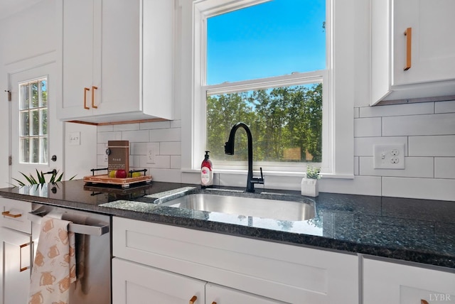 201 Thomas Rd, Lynchburg, VA 24501 - kitchen featuring stainless steel dishwasher, white cabinetry, dark stone counters, and backsplash