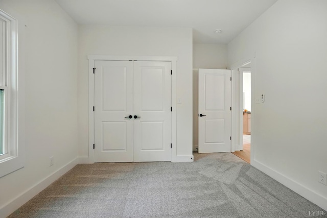 201 Thomas Rd, Lynchburg, VA 24501 - unfurnished bedroom featuring light colored carpet and a closet