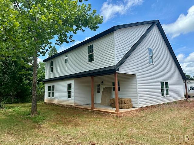 128 Riverside Dr, Lynchburg, VA 24503 - back of property with a patio area and a lawn