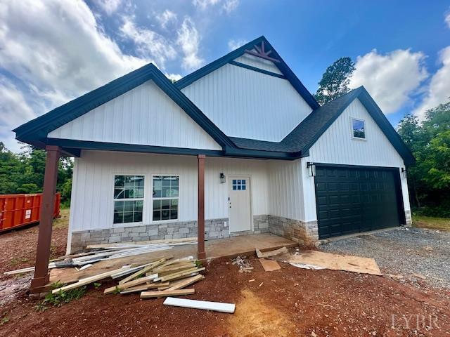 128 Riverside Dr, Lynchburg, VA 24503 - view of front facade with driveway and stone siding