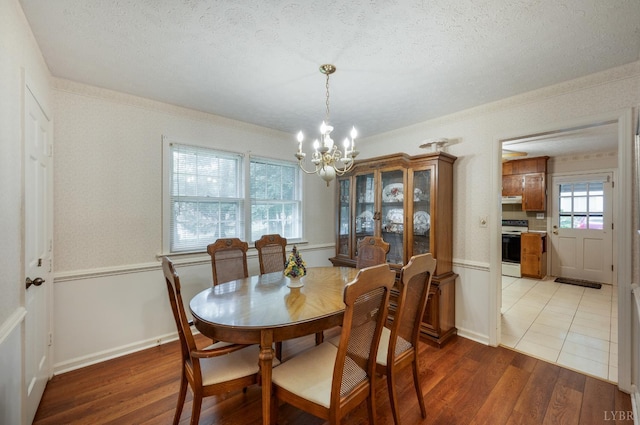 313 Robin Dr, Lynchburg, VA 24502 - dining space with a chandelier, light wood finished floors, and a textured ceiling