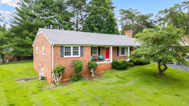 313 Robin Dr, Lynchburg, VA 24502 - ranch-style house with a chimney, brick siding, a front yard, and roof with shingles