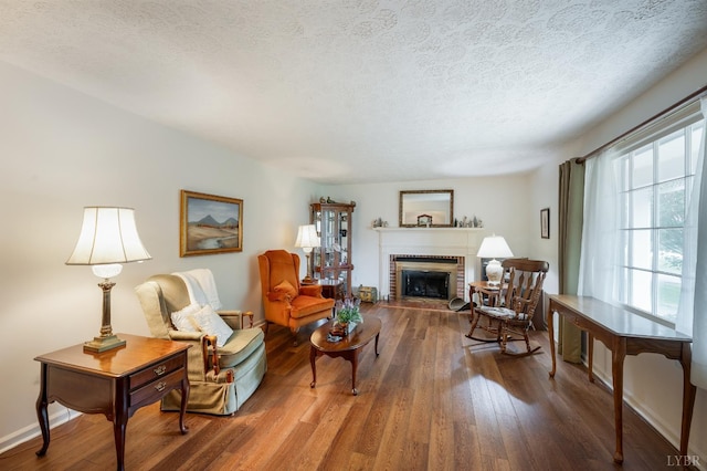 313 Robin Dr, Lynchburg, VA 24502 - living room featuring a textured ceiling, a fireplace, and wood finished floors
