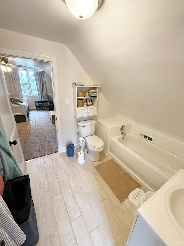 1309 Cherokee Ave, Lynchburg, VA 24502 - bathroom featuring lofted ceiling, a bath, wood finished floors, vanity, and connected bathroom
