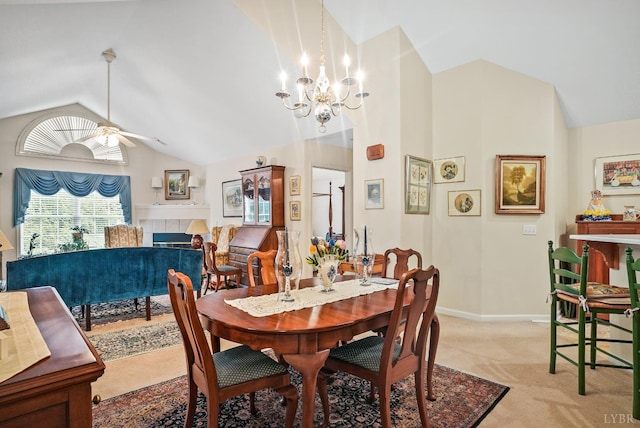 158 Salisbury Cir, Lynchburg, VA 24502 - dining room featuring vaulted ceiling, light colored carpet, a tiled fireplace, a ceiling fan, and a chandelier