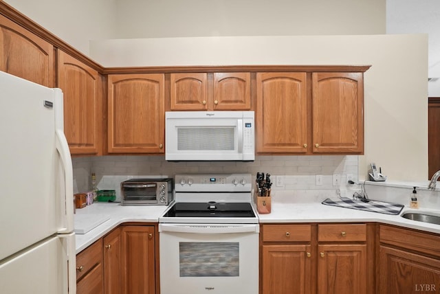 158 Salisbury Cir, Lynchburg, VA 24502 - kitchen with white appliances, tasteful backsplash, light countertops, and brown cabinets