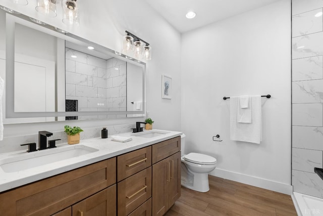 217 Stonegate Way, Danville, VA 24541 - full bathroom featuring double vanity, wood finished floors, and a tile shower