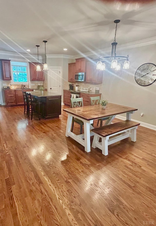 1481 Helmsdale Dr, Forest, VA 24551 - dining area with ornamental molding, wood finished floors, and recessed lighting