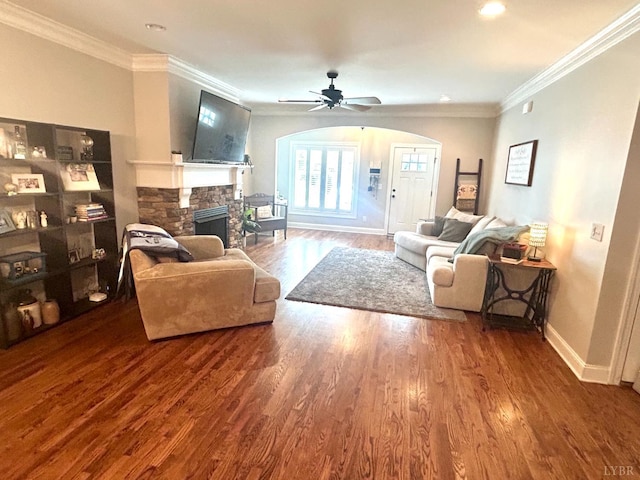 1481 Helmsdale Dr, Forest, VA 24551 - living room featuring wood finished floors, ceiling fan, a fireplace, ornamental molding, and arched walkways