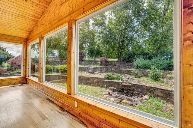 581 Ben Annie Rd, Gretna, VA 24557 - unfurnished sunroom with lofted ceiling, hardwood / wood-style flooring, wooden ceiling, and wooden walls