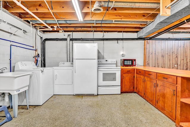 581 Ben Annie Rd, Gretna, VA 24557 - laundry room with separate washer and dryer and concrete block wall