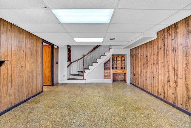 581 Ben Annie Rd, Gretna, VA 24557 - finished basement with wooden walls, a paneled ceiling, and stairway