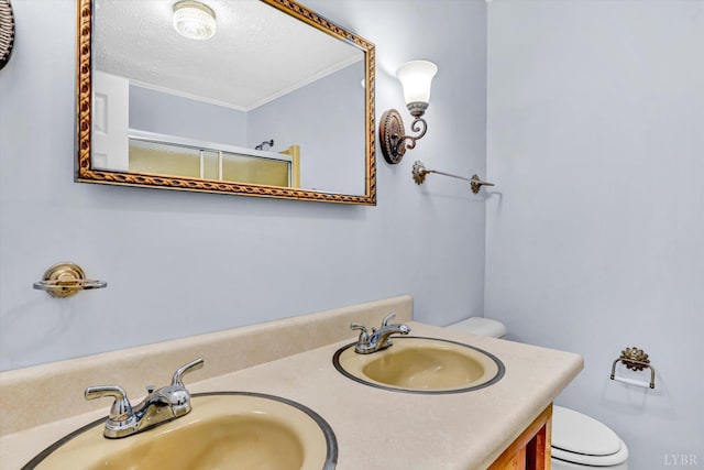 581 Ben Annie Rd, Gretna, VA 24557 - bathroom with a textured ceiling, double vanity, crown molding, and a shower