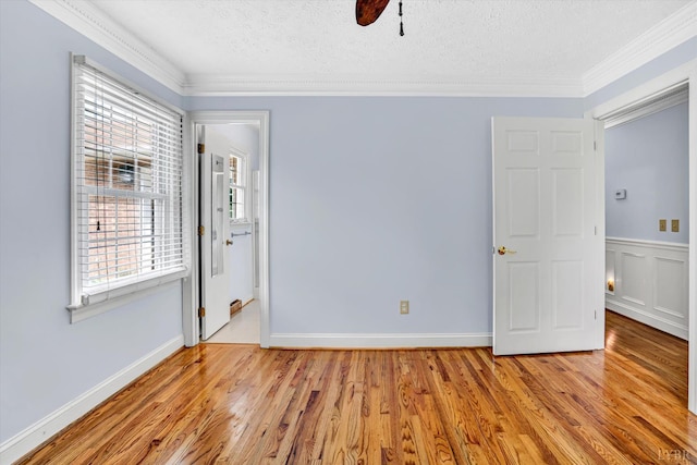 581 Ben Annie Rd, Gretna, VA 24557 - unfurnished bedroom featuring ornamental molding, wood finished floors, a textured ceiling, and ceiling fan