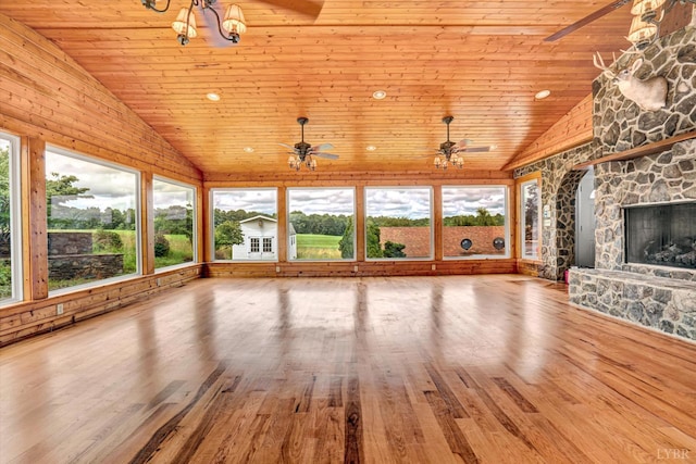 581 Ben Annie Rd, Gretna, VA 24557 - unfurnished living room with healthy amount of natural light, wooden ceiling, a stone fireplace, wood finished floors, and high vaulted ceiling