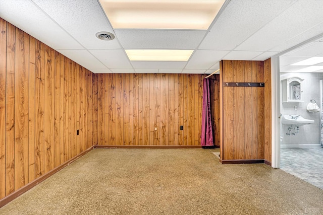 581 Ben Annie Rd, Gretna, VA 24557 - unfurnished room with a paneled ceiling, wooden walls, and carpet