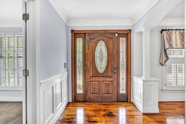 581 Ben Annie Rd, Gretna, VA 24557 - entrance foyer with ornate columns, wood finished floors, ornamental molding, and a wainscoted wall