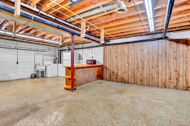 581 Ben Annie Rd, Gretna, VA 24557 - unfinished below grade area with washer and clothes dryer, concrete block wall, and wooden walls
