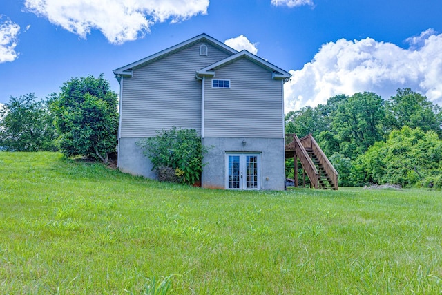 1121 Red Hill Rd, Big Island, VA 24526 - view of side of home featuring french doors, stairs, a wooden deck, and a lawn